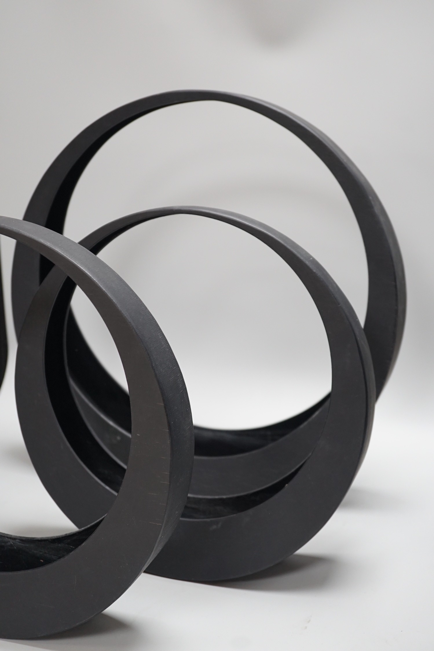 A Japanese bronze bottle vase, 30cm high, three circular black painted wooden abstract sculptures, possibly by Huw Powell Roberts, tallest 42.5cms
